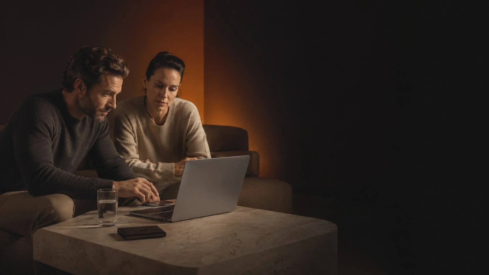 Two founders reviewing their white-label product on a laptop